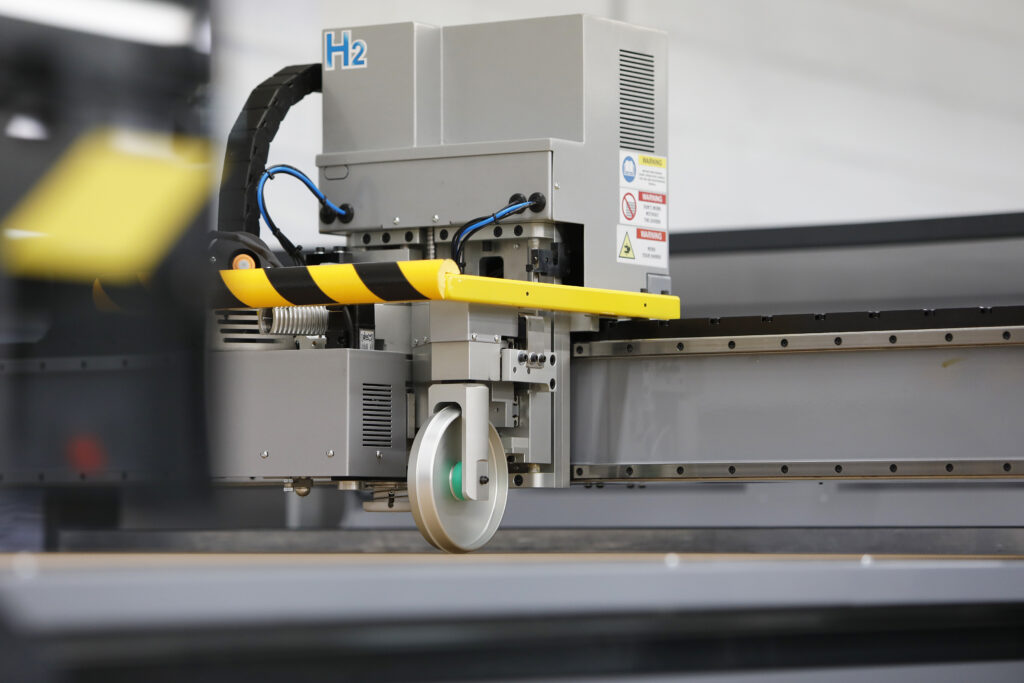 Close-up of the cutting head marked H2, one of two independent multi-tool heads on a VT Group Elitron Kombo TAV-R die cutter
